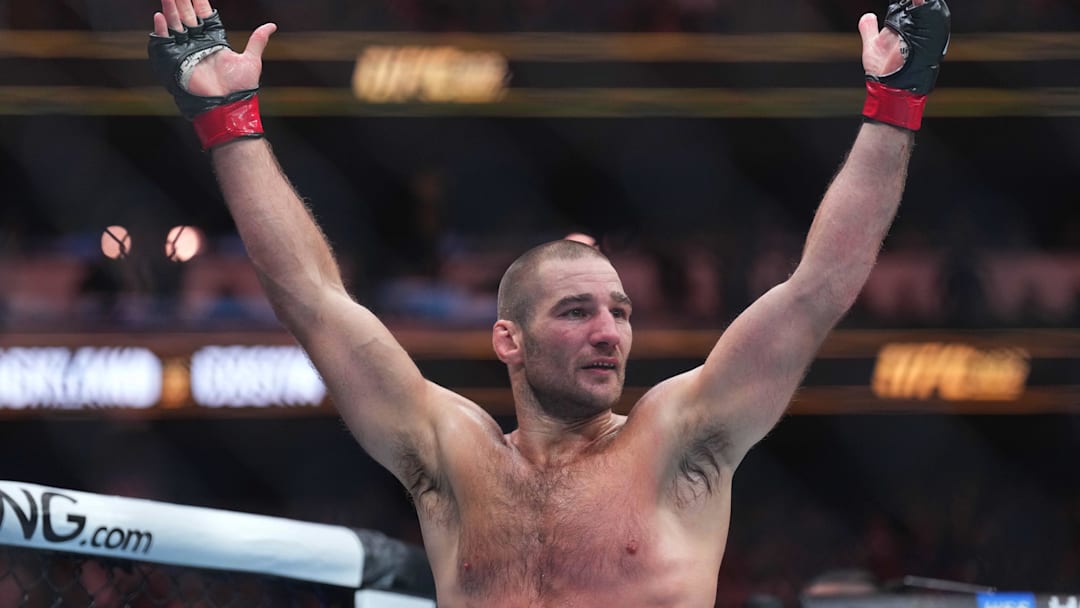 Jun 1, 2024; Newark, New Jersey, USA; Sean Strickland (red gloves)celebrates defeating Paulo Costa (blue gloves) during UFC 302 at Prudential Center. Mandatory Credit: Joe Camporeale-USA TODAY Sports