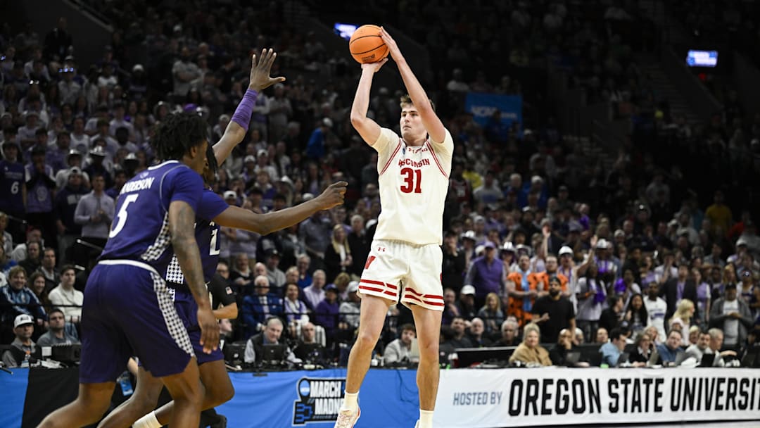 Mar 19, 2026; Portland, OR, USA; Wisconsin Badgers forward Nolan Winter (31) shoots against the High Point Panthers during the second half of a first round game of the men's 2026 NCAA Tournament at Moda Center. Mandatory Credit: Troy Wayrynen-Imagn Images