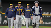 Sep 10, 2025; Arlington, Texas, USA; Milwaukee Brewers starting pitcher Freddy Peralta (51) and catcher Danny Jansen (33) walk to the dugout before the first inning against the Texas Rangers at Globe Life Field. Mandatory Credit: Jim Cowsert-Imagn Images