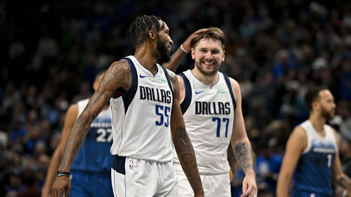 Jones Jr. and Doncic celebrate during a game with the Mavericks. 