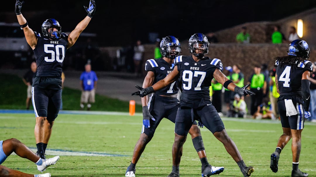 Sep 28, 2024; Durham, North Carolina, USA; Duke Blue Devils defensive end Kevin O'Connor (50) and defensive end Wesley Williams (97) celebrates during the second half of the game against North Carolina Tar Heels at Wallace Wade Stadium. Mandatory Credit: Jaylynn Nash-Imagn Images