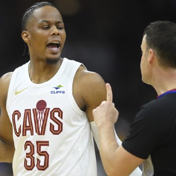 Apr 20, 2024; Cleveland, Ohio, USA; Cleveland Cavaliers forward Isaac Okoro (35) talks with referee Mark Lindsay (29) in the second quarter against the Orlando Magic during game one of the first round for the 2024 NBA playoffs at Rocket Mortgage FieldHouse. Mandatory Credit: David Richard-USA TODAY Sports