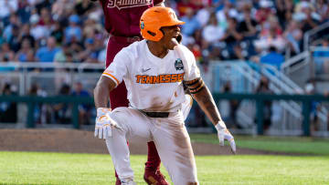 Jun 14, 2024; Omaha, NE, USA; Tennessee Volunteers second baseman Christian Moore (1) celebrates after hitting a triple against the Florida State Seminoles during the first inning at Charles Schwab Filed Omaha. Mandatory Credit: Dylan Widger-USA TODAY Sports
