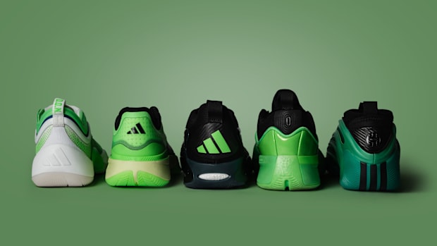 Five green adidas sneakers.
