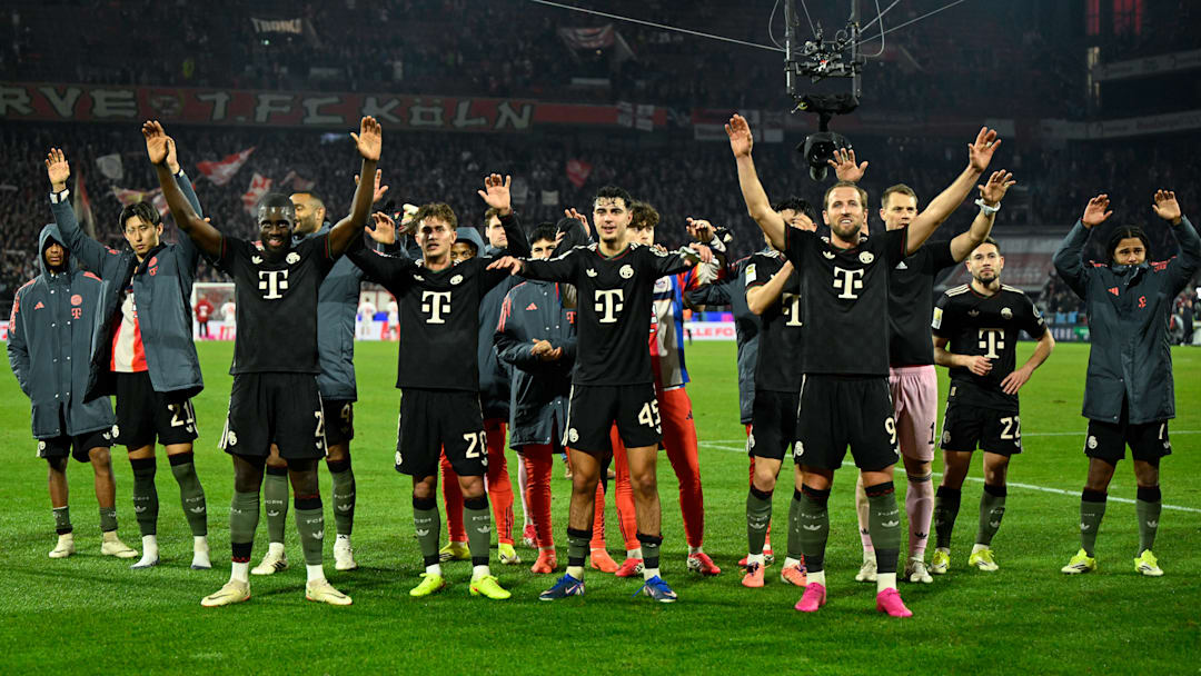 Bayern Munich players celebrating with fans after 3-1 win against FC Koln.