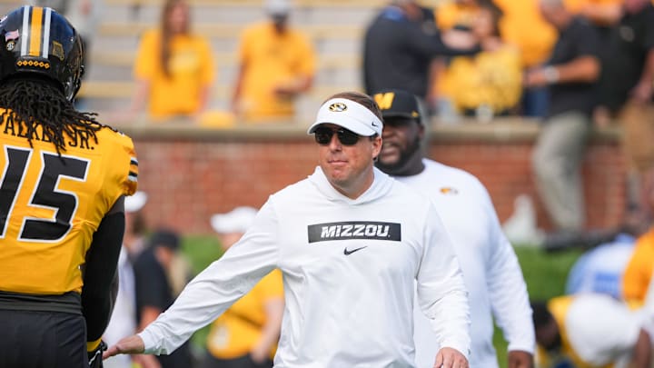 Sep 14, 2024; Columbia, Missouri, USA; Missouri Tigers head coach Eli Drinkwitz greets players against the Boston College Eagles prior to a game at Faurot Field at Memorial Stadium. Mandatory Credit: Denny Medley-Imagn Images