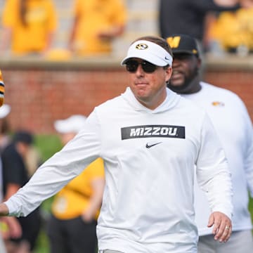 Sep 14, 2024; Columbia, Missouri, USA; Missouri Tigers head coach Eli Drinkwitz greets players against the Boston College Eagles prior to a game at Faurot Field at Memorial Stadium. Mandatory Credit: Denny Medley-Imagn Images