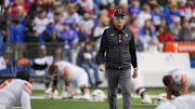 Nov 1, 2025; Lawrence, Kansas, USA; Oklahoma State Cowboys head coach Doug Meacham during warmups prior to a game against the Kansas Jayhawks at David Booth Kansas Memorial Stadium. Mandatory Credit: Jay Biggerstaff-Imagn Images