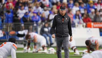 Nov 1, 2025; Lawrence, Kansas, USA; Oklahoma State Cowboys head coach Doug Meacham during warmups prior to a game against the Kansas Jayhawks at David Booth Kansas Memorial Stadium. Mandatory Credit: Jay Biggerstaff-Imagn Images