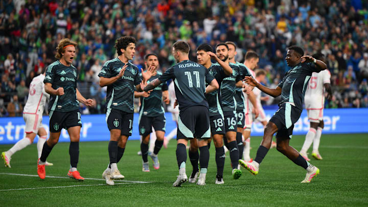 The Seattle Sounders FC celebrate after a penalty kick goal scored by Albert Rusnak (11) during the first half against the St. Louis City FC 