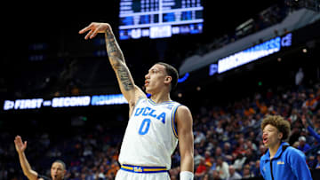 UCLA Bruins guard Kobe Johnson shoots the ball against the Utah State Aggies in the first round of the NCAA Tournament