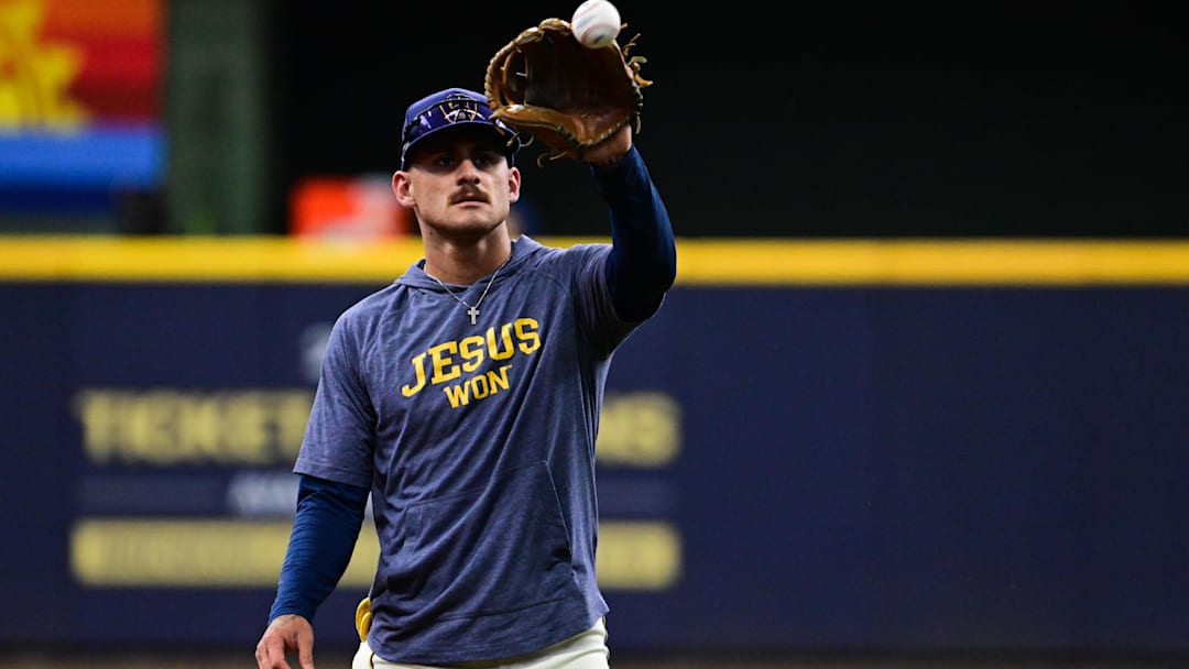 Oct 6, 2025; Milwaukee, Wisconsin, USA; Milwaukee Brewers shortstop Joey Ortiz (3) warms up before the game against the Chicago Cubs during game two of the NLDS round for the 2025 MLB playoffs at American Family Field. Mandatory Credit: Benny Sieu-Imagn Images