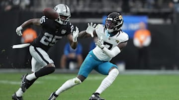 Dec 22, 2024; Paradise, Nevada, USA;Jacksonville Jaguars wide receiver Brian Thomas Jr. (7) makes a catch against Las Vegas Raiders cornerback Decamerion Richardson (25) in the first half at Allegiant Stadium. ¡