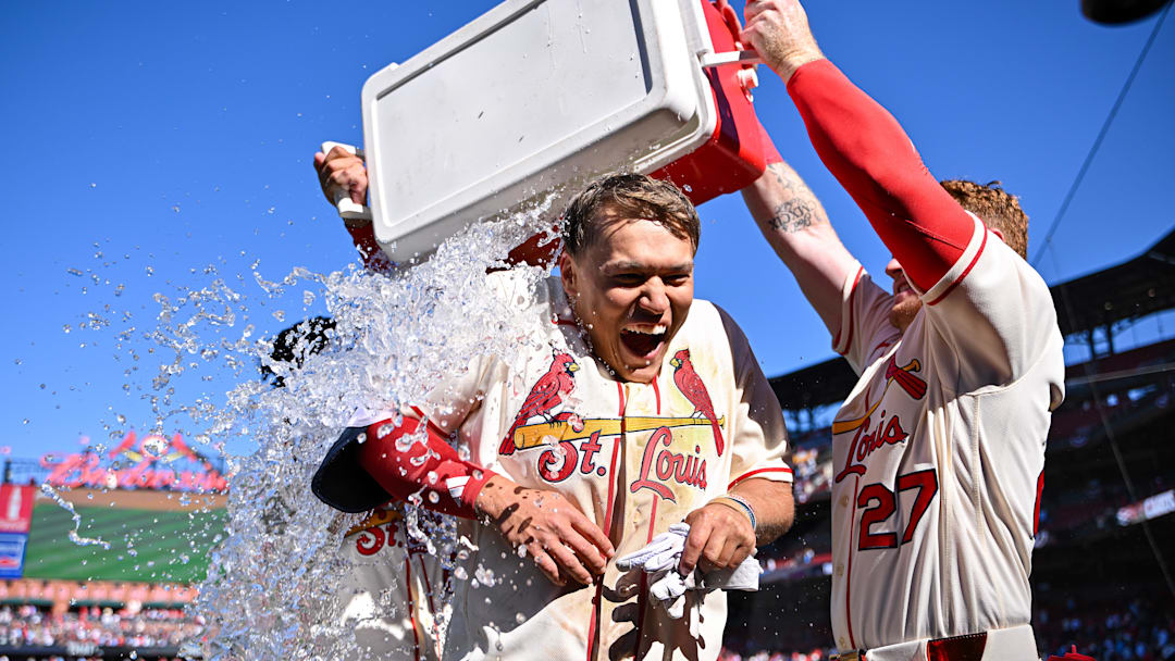 Mar 28, 2026; St. Louis, Missouri, USA; St. Louis Cardinals shortstop JJ Wetherholt (26) is doused with water by shortstop Masyn Winn (0) and left fielder Nathan Church (27) after hitting a walk-off two-run single against the Tampa Bay Rays during the tenth inning at Busch Stadium. Mandatory Credit: Jeff Curry-Imagn Images