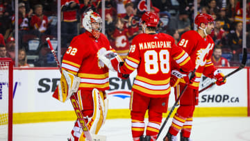 Apr 18, 2024; Calgary, Alberta, CAN; Calgary Flames goaltender Dustin Wolf (32) celebrate win with teammates after defeating San Jose Sharks at Scotiabank Saddledome. Mandatory Credit: Sergei Belski-USA TODAY Sports