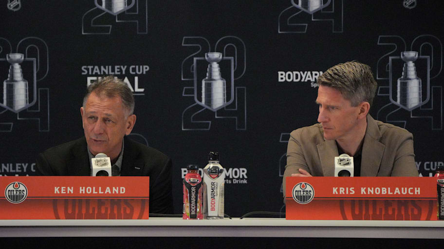 Ken Holland (left) answers questions before the 2024 Stanley Cup finals. | Jim Rassol-Imagn Images