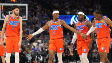 Dec 14, 2023; Sacramento, California, USA; Oklahoma City Thunder guard Shai Gilgeous-Alexander (2) walks to the bench with forwards Chet Holmgren (7) and Jalen Williams (8) and guard Luguentz Dort (second from right) during the fourth quarter against the Sacramento Kings at Golden 1 Center. Mandatory Credit: Darren Yamashita-USA TODAY Sports