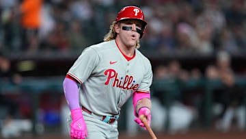 Sep 20, 2025; Phoenix, Arizona, USA; Philadelphia Phillies outfielder Harrison Bader (2) flips his bat after drawing a walk against the Arizona Diamondbacks during the first inning at Chase Field.