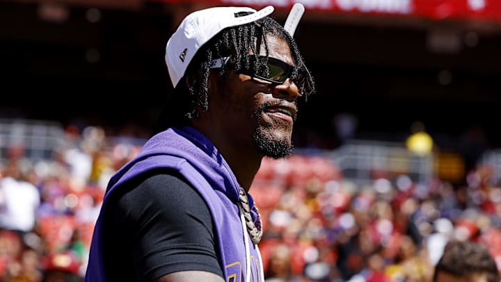 Aug 23, 2025; Landover, Maryland, USA; Baltimore Ravens quarterback Lamar Jackson (8) walks on the field before the game against the Washington Commanders at Northwest Stadium. Mandatory Credit: Peter Casey-Imagn Images