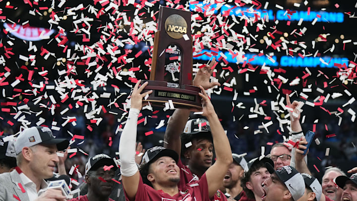 Mar 30, 2024; Los Angeles, CA, USA; Alabama Crimson Tide guard Mark Sears (1) celebrates with the trophy after defeating the Clemson Tigers in the finals of the West Regional of the 2024 NCAA Tournament at Crypto.com Arena. Mandatory Credit: Kirby Lee-Imagn Images