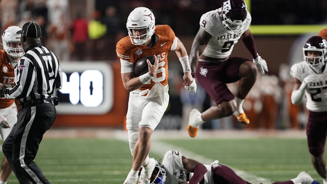 Texas Longhorns quarterback Arch Manning keeps the ball and runs for a touchdown during the second half against the Texas A&M Aggies at Darrell K Royal-Texas Memorial Stadium.