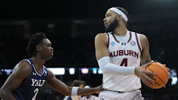 Mar 22, 2024; Spokane, WA, USA; Auburn Tigers forward Johni Broome (4) drives to the basket against Yale Bulldogs guard Bez Mbeng (2) during the first half of a game in the first round of the 2024 NCAA Tournament at Spokane Veterans Memorial Arena. Mandatory Credit: Kirby Lee-Imagn Images 