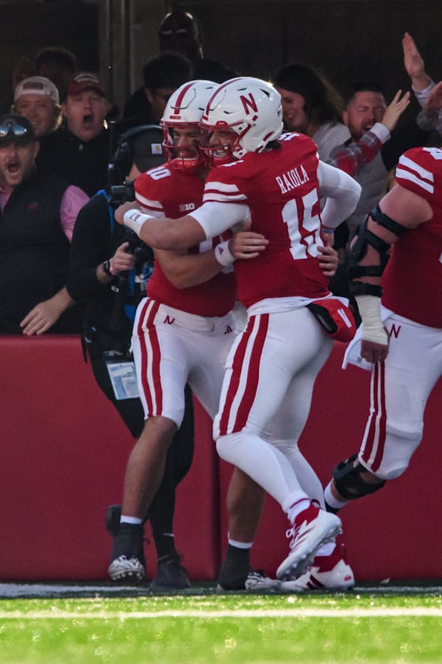Henrich Haarberg (10) and Dylan Raiola (15) celebrate Haarberg's rushing touchdown on Nebraska's opening drive. 