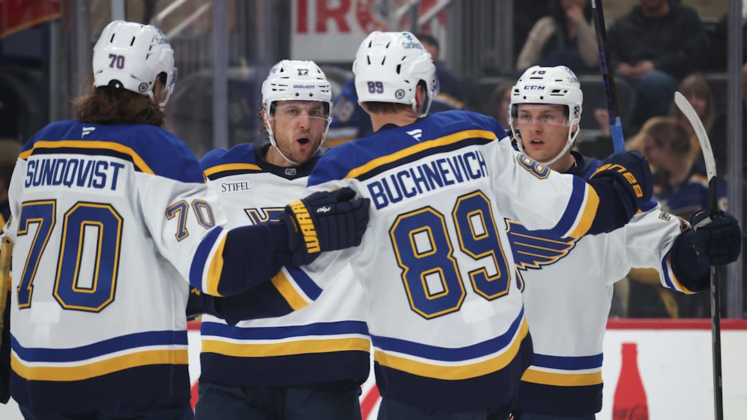 Mar 13, 2025; Pittsburgh, Pennsylvania, USA;  St. Louis Blues center Oskar Sundqvist (70) and defenseman Cam Fowler (17) and left wing Pavel Buchnevich (89) celebrate with center Zack Bolduc (right) after Bolduc scored a gaol against the Pittsburgh Penguins during the second period at PPG Paints Arena. Mandatory Credit: Charles LeClaire-Imagn Images