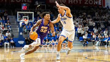 Northern Iowa's Tytan Anderson (32) drives past Drake's Daniel Abreu (54) on Wednesday, Jan. 29, 2025, at the Knapp Center.