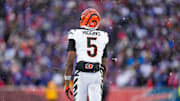 Cincinnati Bengals wide receiver Tee Higgins (5) walks for the sideline after hitting his head for a second time in the fourth quarter of the NFL Week 14 game between the Buffalo Bills and the Cincinnati Bengals at Highmark Stadium in Orchard Park, N.Y., on Sunday, Dec. 7, 2025. The Bills overcame a halftime deficit to win 39-34.