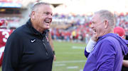 Arkansas head coach Sam Pittman talks to LSU head coach Brian Kelly prior to a game at Razorback Stadium. 