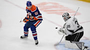 Apr 14, 2025; Edmonton, Alberta, CAN; Edmonton Oilers right winger Corey Perry (90) watches the puck hit Los Angeles Kings goalie Darcy Kuemper (35) during the first period at Rogers Place. Mandatory Credit: Walter Tychnowicz-Imagn Images