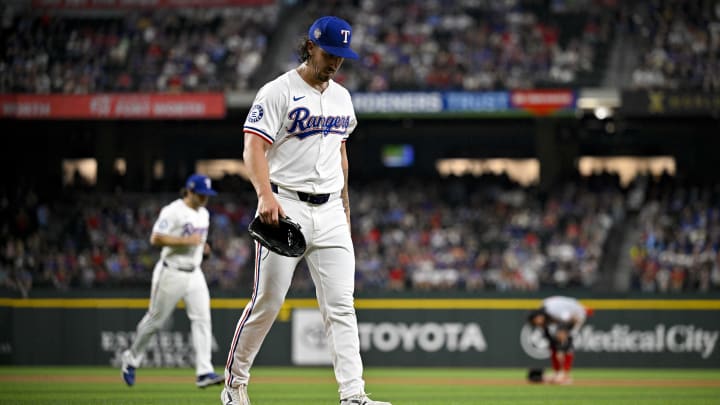 Apr 27, 2024; Arlington, Texas, USA; Texas Rangers starting pitcher Michael Lorenzen (23) comes off the field after pitching against the Cincinnati Reds during the second inning at Globe Life Field. Mandatory Credit: Jerome Miron-USA TODAY Sports