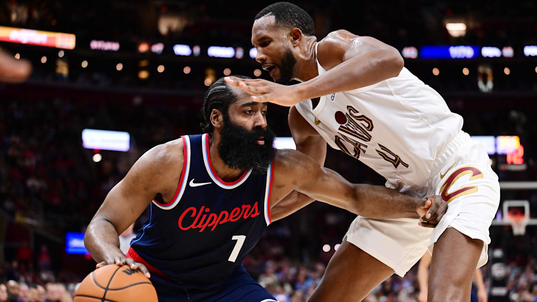 Mar 30, 2025; Cleveland, Ohio, USA; Los Angeles Clippers guard James Harden (1) drives to the basket against Cleveland Cavaliers forward Evan Mobley (4) during the second half at Rocket Arena. Mandatory Credit: Ken Blaze-Imagn Images

