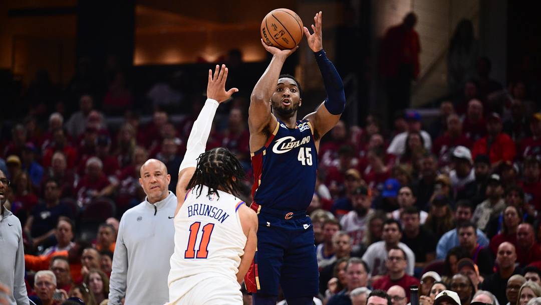 May 25, 2026; Cleveland, Ohio, USA; Cleveland Cavaliers guard Donovan Mitchell (45) shoots while defended by New York Knicks guard Jalen Brunson (11) in the third quarter during game four of the eastern conference finals for the 2026 NBA playoffs at Rocket Arena. Mandatory Credit: Ken Blaze-Imagn Images