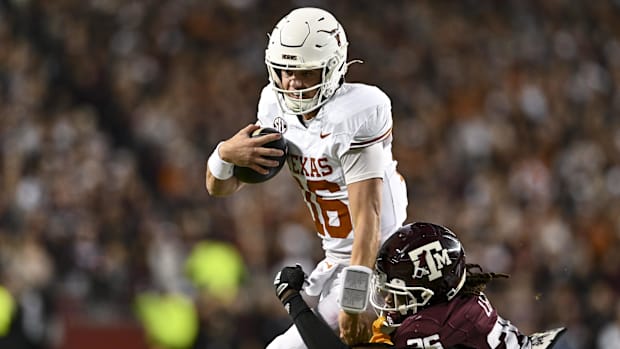 Texas Longhorns quarterback Arch Manning (16) runs the ball  vs. Texas A&M