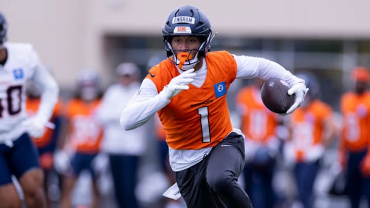 Denver Broncos tight end Evan Engram (1) runs a route during an OTA practice at Broncos Park Powered by CommonSpirit.
