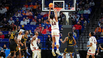 Mar 20, 2025; Lexington, KY, USA;  Auburn Tigers center Dylan Cardwell (44) dunks the ball during the second half against the Alabama State Hornets in the first round of the NCAA Tournament at Rupp Arena. Mandatory Credit: Aaron Doster-Imagn Images