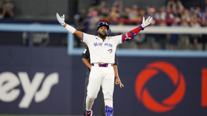 Jun 29, 2024; Toronto, Ontario, CAN; Toronto Blue Jays first base Vladimir Guerrero Jr. (27) celebrates his double against the New York Yankees during the sixth inning at Rogers Centre.