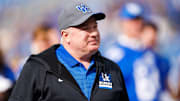 Nov 15, 2025; Lexington, Kentucky, USA; Kentucky Wildcats head coach Mark Stoops greets players during the senior day celebration before the game against the Tennessee Tech Golden Eagles at Kroger Field. Mandatory Credit: Jordan Prather-Imagn Images