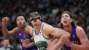 Feb 5, 2025; Toronto, Ontario, CAN; Memphis Grizzlies center Zach Edey (14) battles with Toronto Raptors forward Kelly Olynyk (41) during the third quarter at Scotiabank Arena. Mandatory Credit: Nick Turchiaro-Imagn Images
