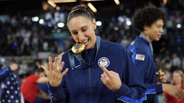 Aug 11, 2024; Paris, France; United States shooting guard Diana Taurasi (12) celebrates after the receiving the gold medal in women’s basketball during the Paris 2024 Olympic Summer Games at Accor Arena. Mandatory Credit: Kyle Terada-Imagn Images