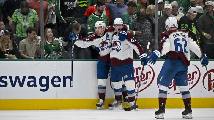 May 15, 2024; Dallas, Texas, USA; Colorado Avalanche center Nathan MacKinnon (29) and defenseman Josh Manson (42) and left wing Artturi Lehkonen (62) celebrates a goal scored by MacKinnon against the Dallas Stars during the third period in game five of the second round of the 2024 Stanley Cup Playoffs at American Airlines Center. Mandatory Credit: Jerome Miron-USA TODAY Sports