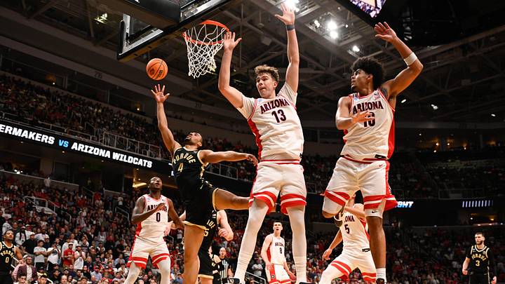 Mar 28, 2026; San Jose, CA, USA; Purdue Boilermakers forward Trey Kaufman-Renn (4) shoots the ball defended by center Motiejus Krivas (13) and forward Koa Peat (10) in the second half during an Elite Eight game of the West Regional of the men's 2026 NCAA Tournament at SAP Center. Mandatory Credit: Eakin Howard-Imagn Images