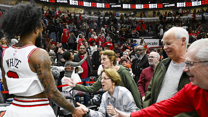 Apr 4, 2025; Chicago, Illinois, USA;  Fans greet Chicago Bulls guard Coby White (0) after the game against the Portland Trail Blazers at the United Center. Mandatory Credit: Matt Marton-Imagn Images