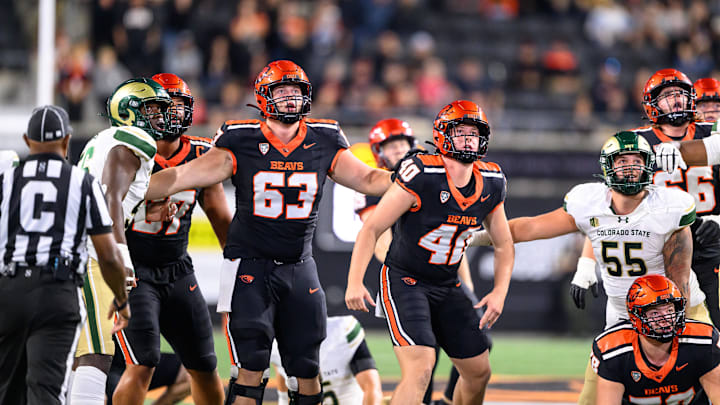 Oct 5, 2024; Corvallis, Oregon, USA; Oregon State Beavers offensive lineman Luka Vincic (63) and long snapper Jackson Robertson (40) watch a game tying field goal that forced overtime during the fourth quarter against the Colorado State Rams at Reser Stadium. Mandatory Credit: Craig Strobeck-Imagn Images