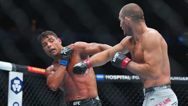 Paulo Costa fighting Sean Stricklan
