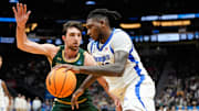 Memphis Tigers forward Dain Dainja (42) attempts to dribble past Colorado State Rams guard Ethan Morton (25) 