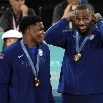 Aug 10, 2024; Paris, France; United States forward LeBron James (6) celebrates with the gold medal after defeating France in the men's basketball gold medal game during the Paris 2024 Olympic Summer Games at Accor Arena. Mandatory Credit: Rob Schumacher-USA TODAY Sports