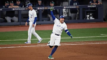 Oct 20, 2025; Toronto, Ontario, CAN; Toronto Blue Jays right fielder George Springer (4) celebrates as he runs the bases after hitting a three run home run against the Seattle Mariners in the seventh inning during game seven of the ALCS round for the 2025 MLB playoffs at Rogers Centre. Mandatory Credit: Dan Hamilton-Imagn Images